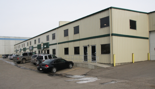 two story building with office and large overhead doors