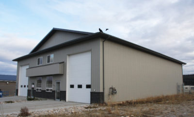 straight wall steel building with mezzanine office and stone facade knee wall