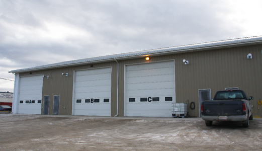 storage building with three large overhead doors