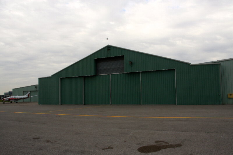 steel building hanger with wide bi-parting sliding doors