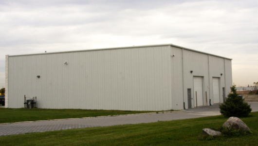 equipment storage building with low pitch roof