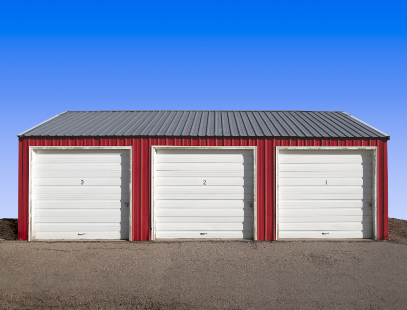 steel 3 car Garage building with three overhead doors