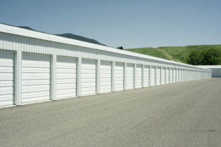 photo of Mini Storage units with white doors and sheeting