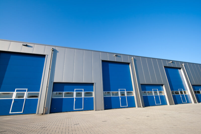 steel building with insulated metal panels and lots of overhead doors