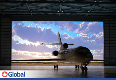 photo of jet aircraft in metal building hanger