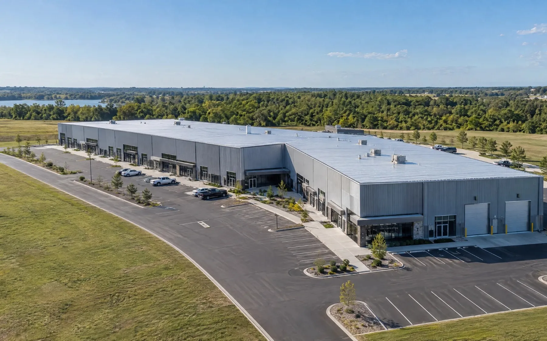 Aerial view of a commercial steel flex building with storefronts and parking